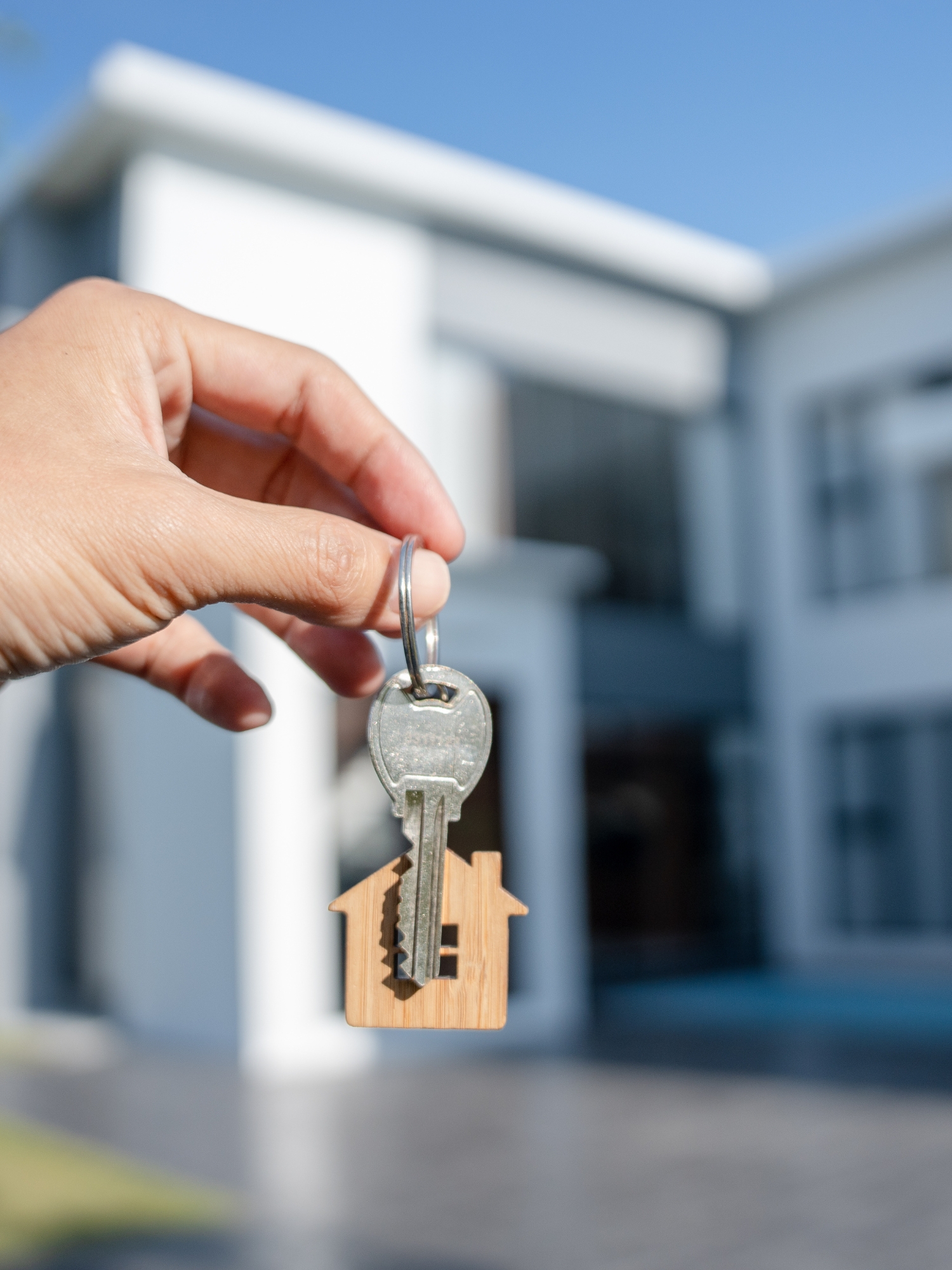 image of real estate agent holding keys to a home